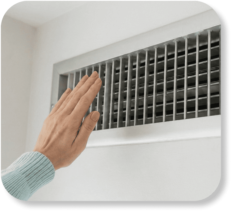 Hand feeling air from AC vent