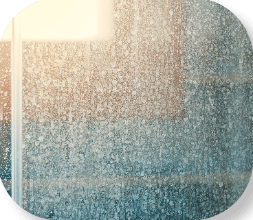 Hard water stains on a shower glass door