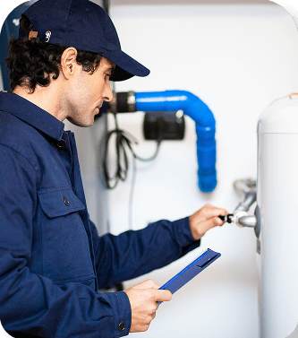 Technician repairing a water heater